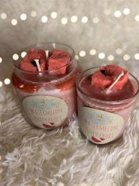 two jars of watermelon scented candles