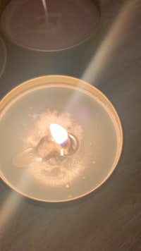 a candle sitting on top of a table